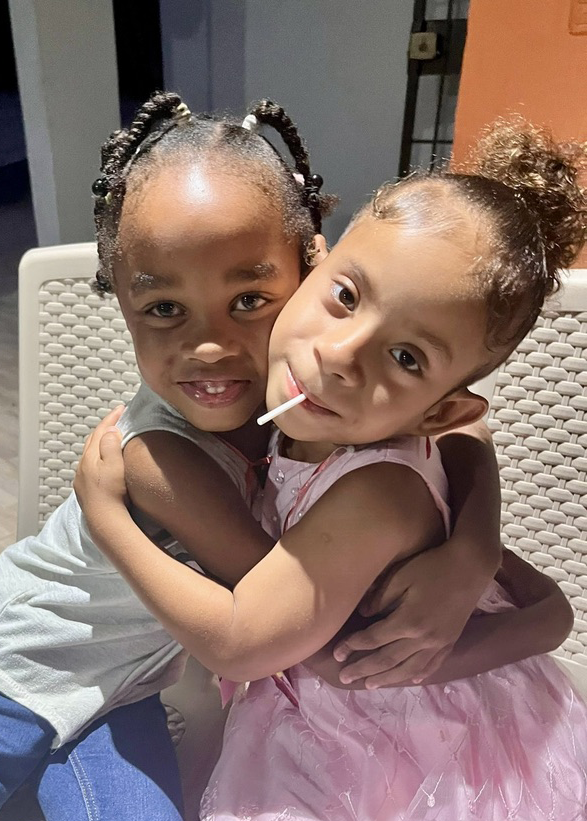 Two young girls share a warm hug at Bright Stars, which provides a safe, nurturing home and supportive environment for children in the Dominican Republic.